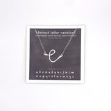 necklace . abstract letters