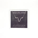 necklace . abstract letters