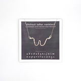 necklace . abstract letters