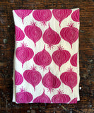 flour sack tea towel . red onions
